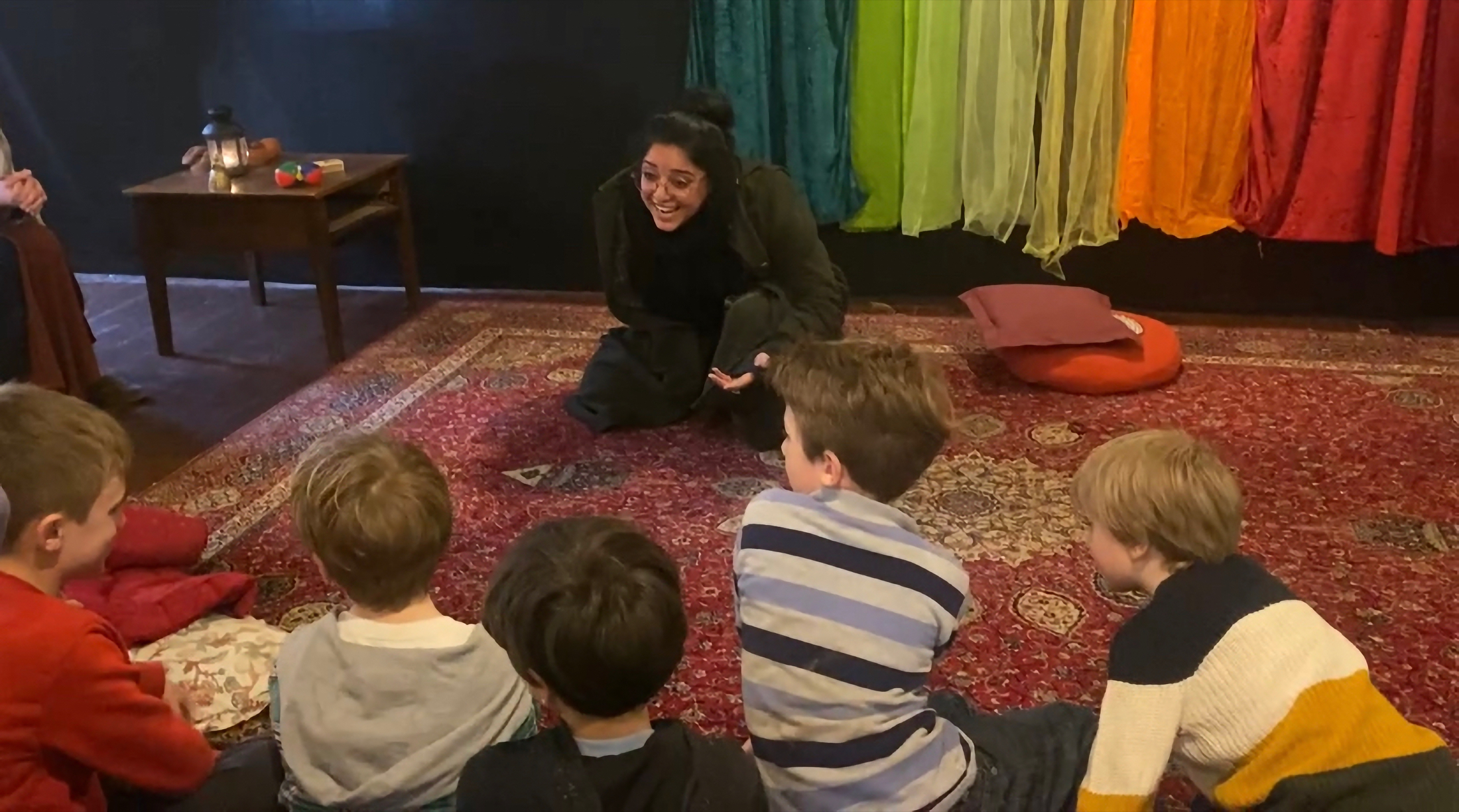 Children gathered for participatory storytelling.