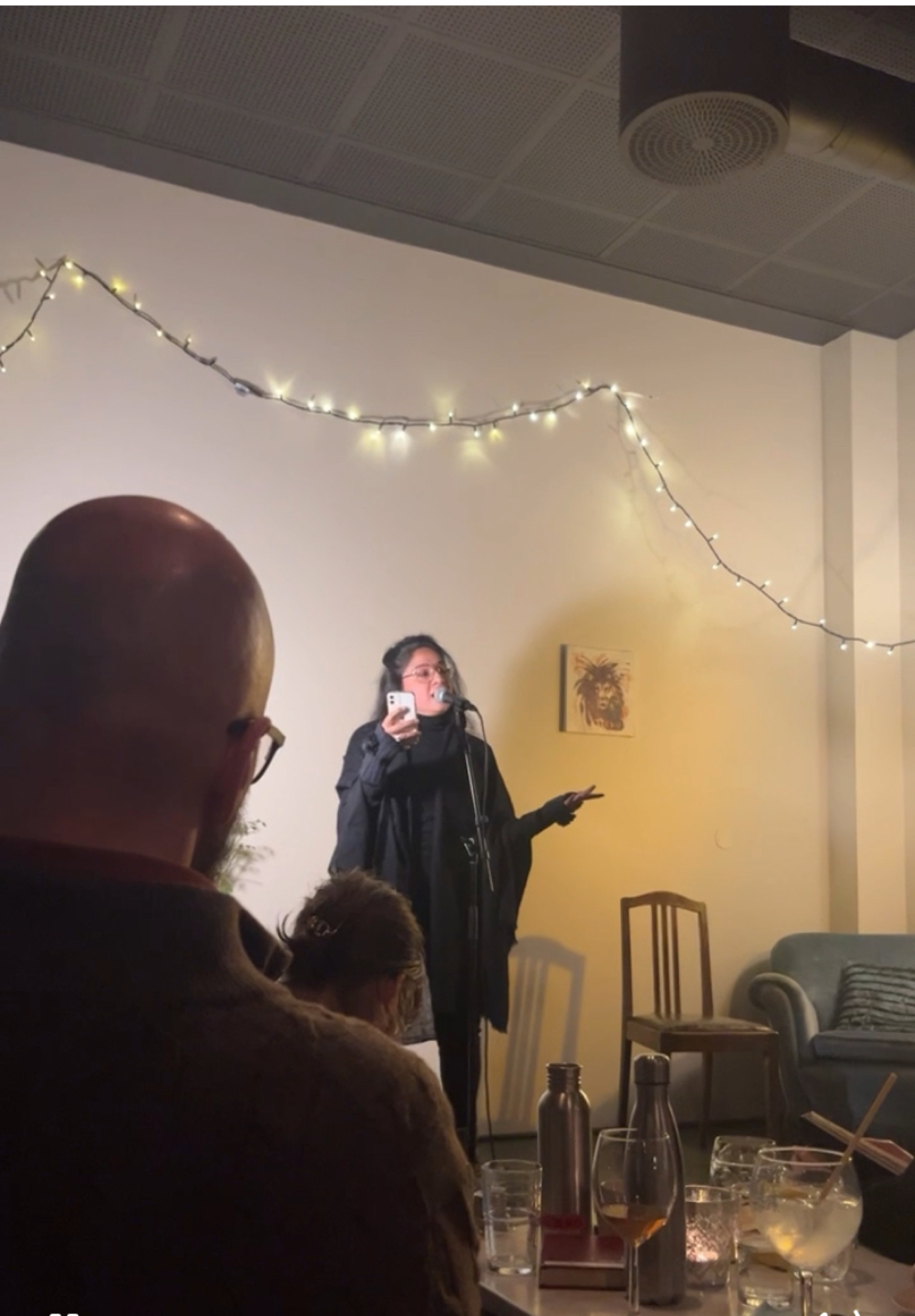 Tall composition capturing movement in performance.